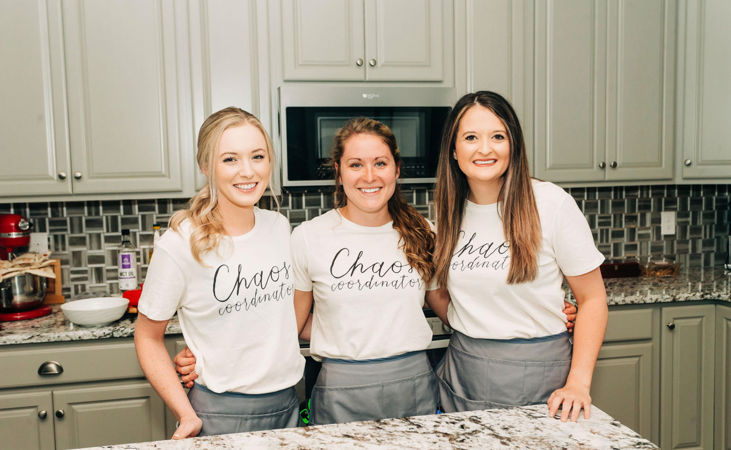 clutterless home solutions team standing in kitchen smiling